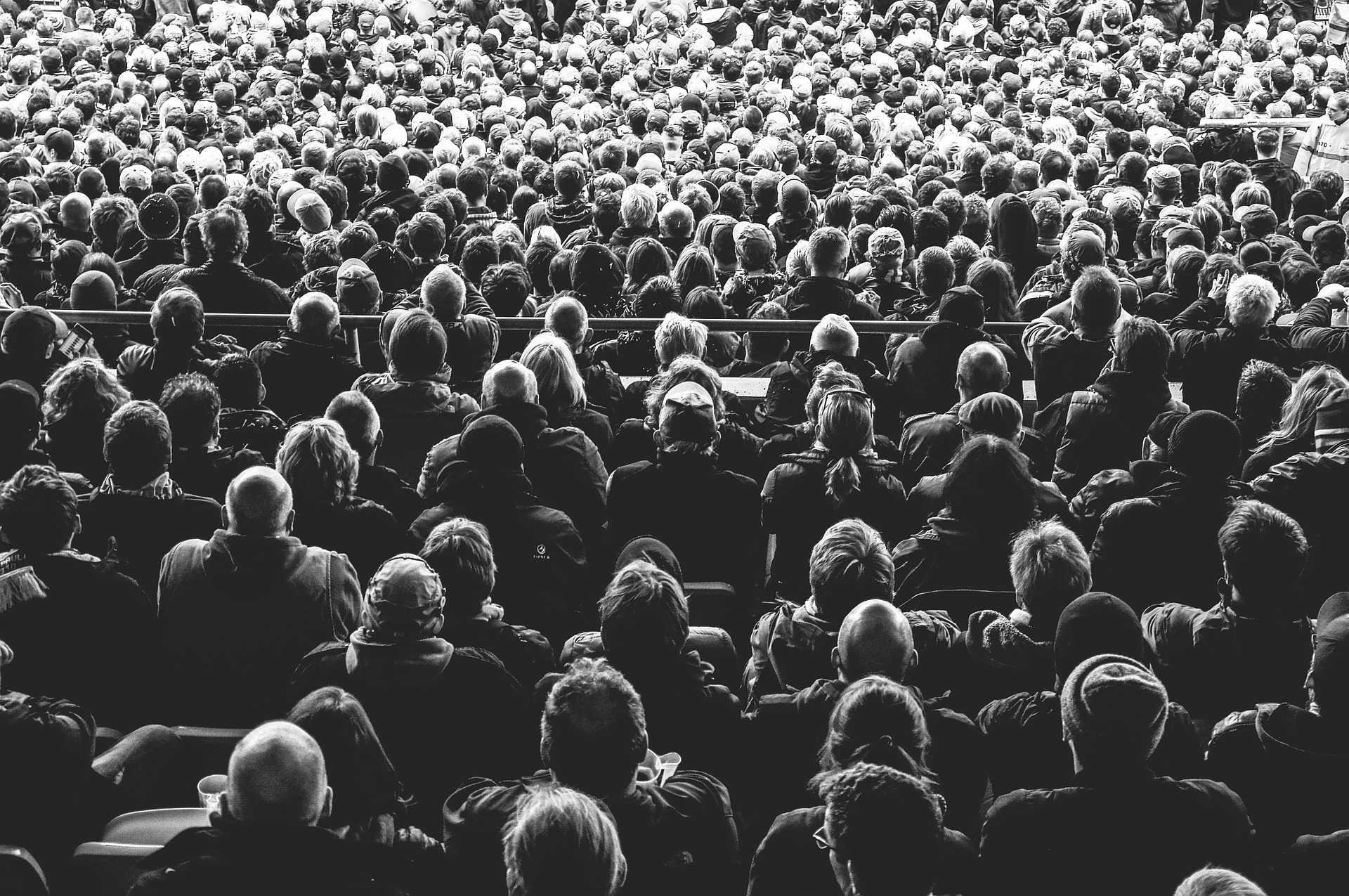 A crowd of people watching a film